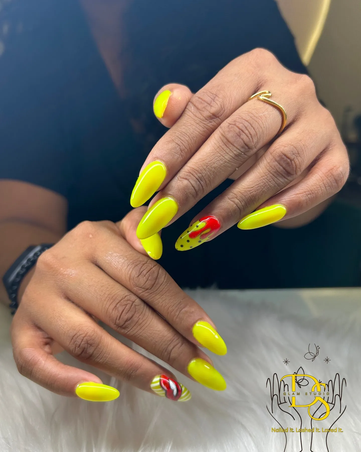 Neon yellow nails with a red accent